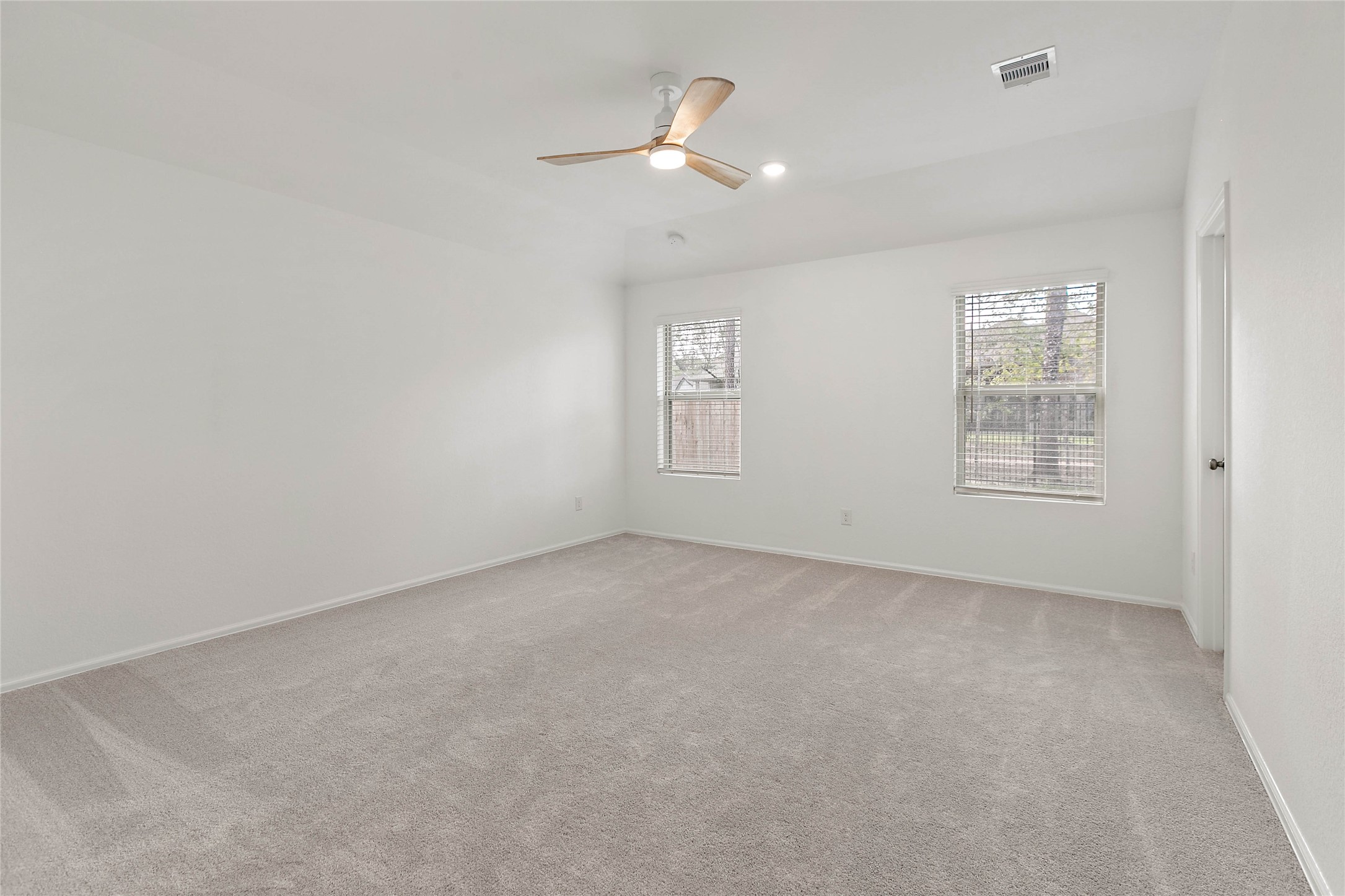 7602 Angels Lndg Lane Porter, TX 77365 - Photo 16 of 32 The primary bedroom overlooks the private backyard.