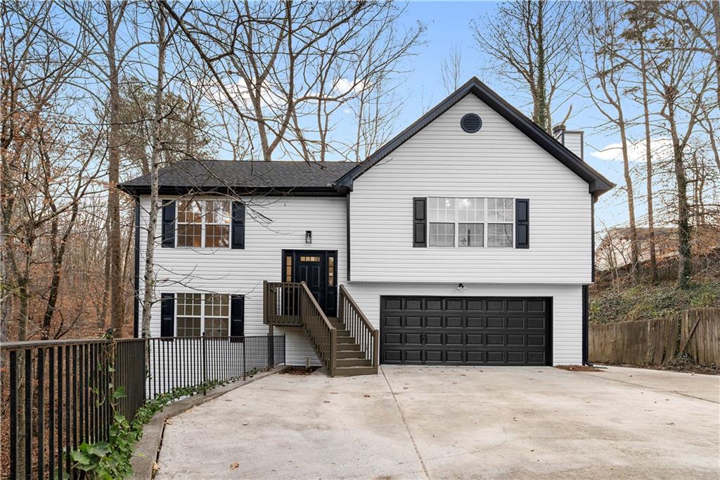 a view of a house with a yard