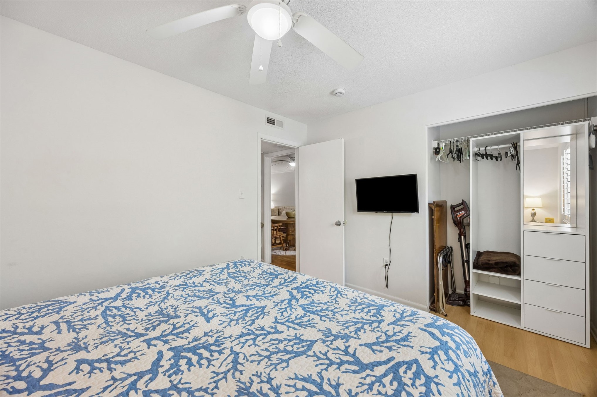 2328 Sadler Road, Unit 1C Fernandina Beach, FL 32034 - Photo 24 of 49 a bedroom with a bed and a flat screen tv