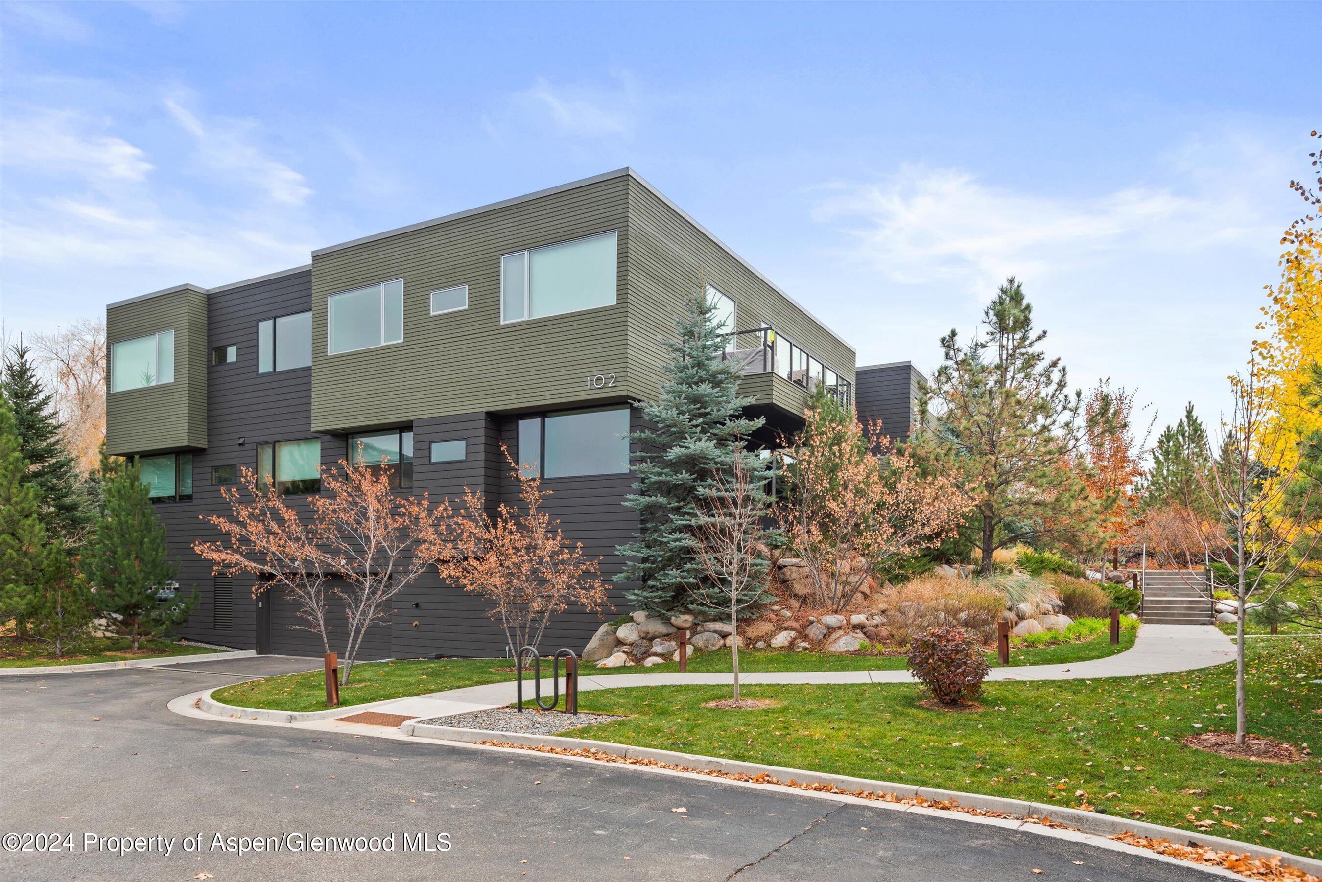102 Evans Road, Unit 106 Basalt, CO 81621 - Photo 11 of 12 a front view of a house with garden