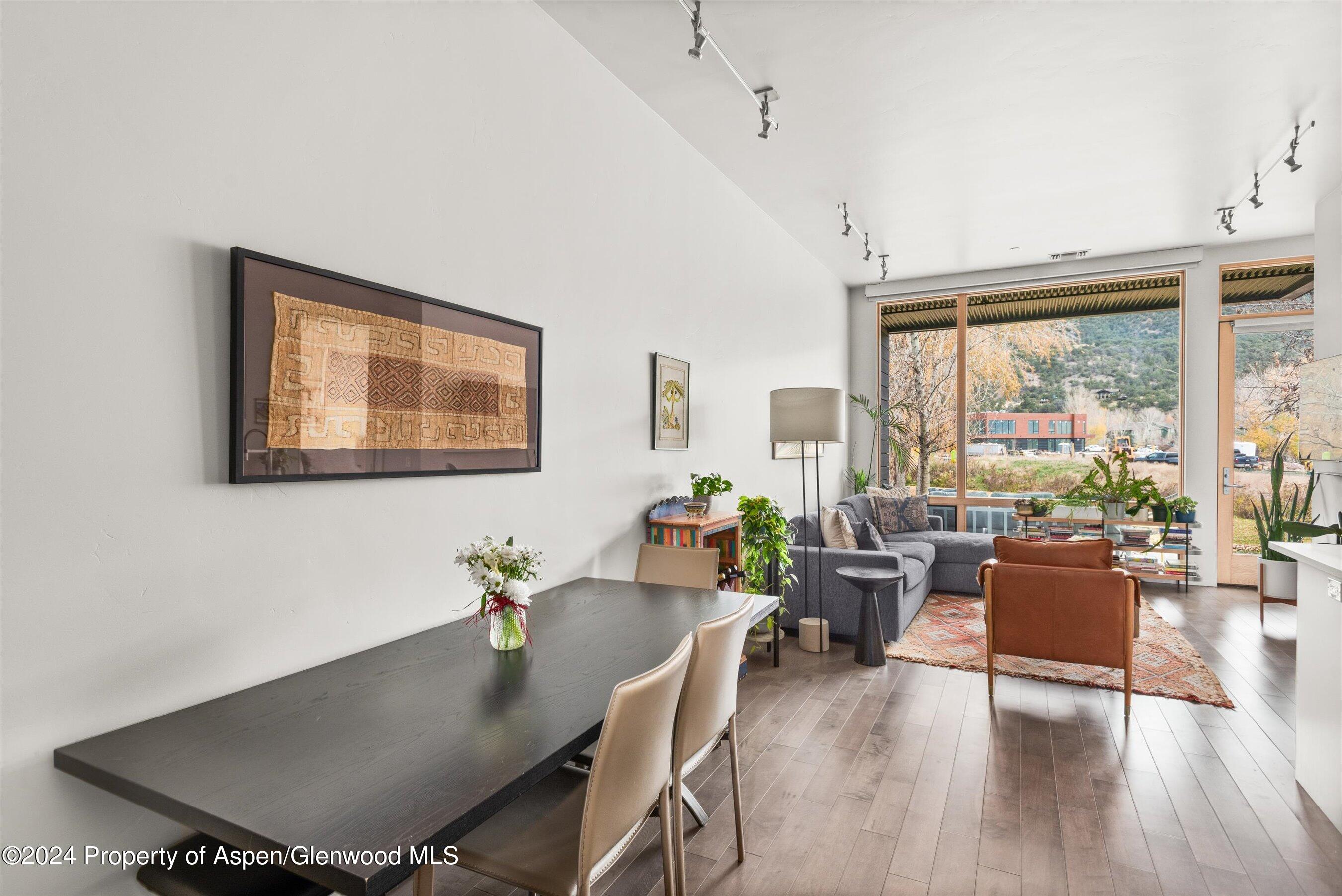 102 Evans Road, Unit 106 Basalt, CO 81621 - Photo 7 of 12 a living room with furniture and a window