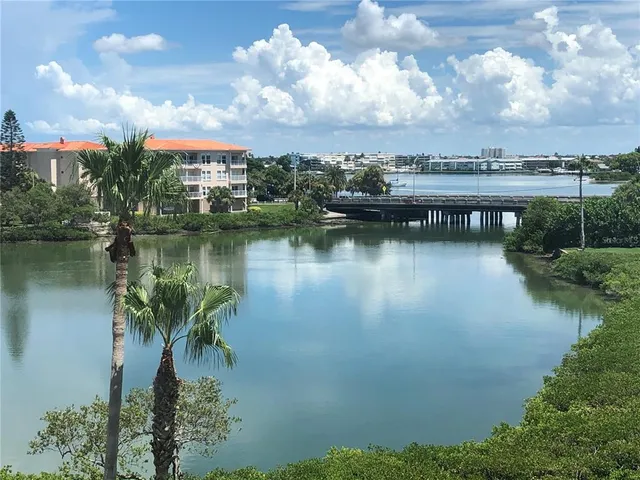 a view of a lake with houses in the back