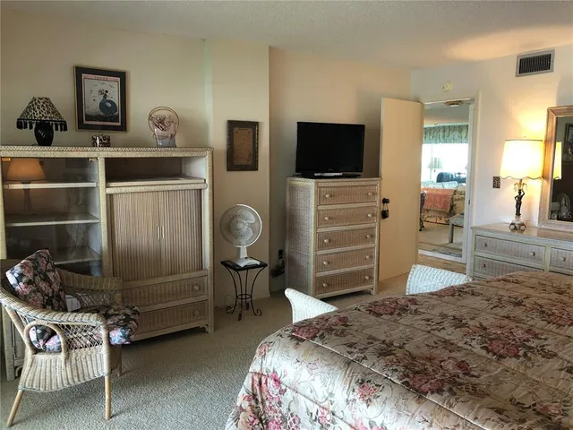 a bedroom with a bed and furniture