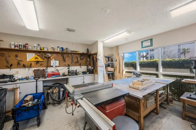 a room with gym equipment and a large window