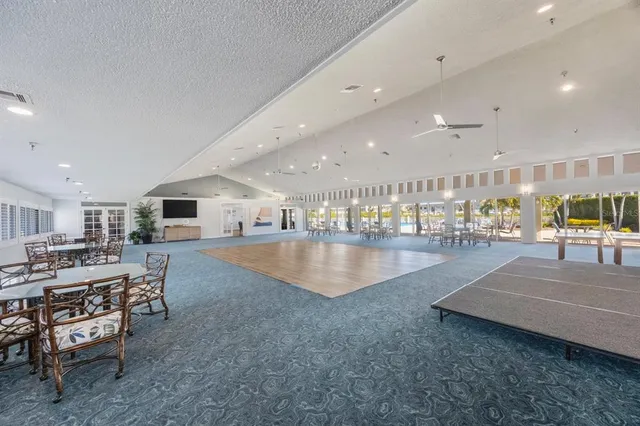 a lobby with furniture and kitchen view