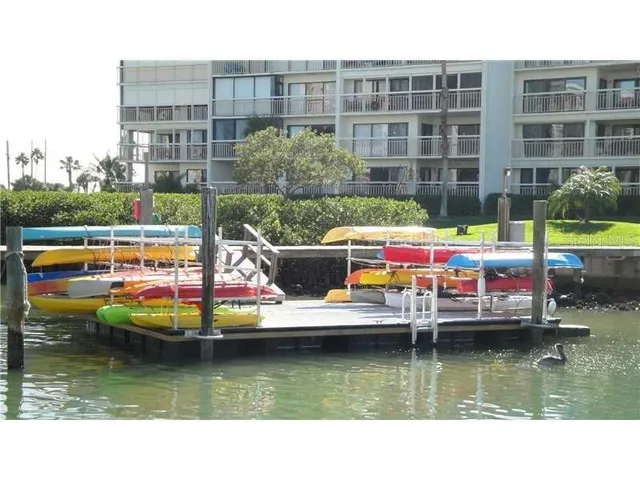 a swimming pool with outdoor seating and yard