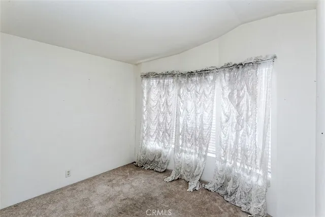 a view of a room with a window and a shower
