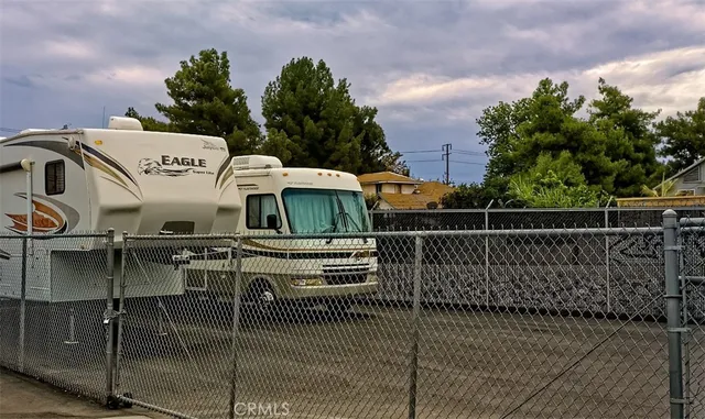 an outdoor space with furniture and garden
