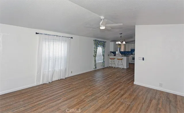a view of a kitchen with wooden floor