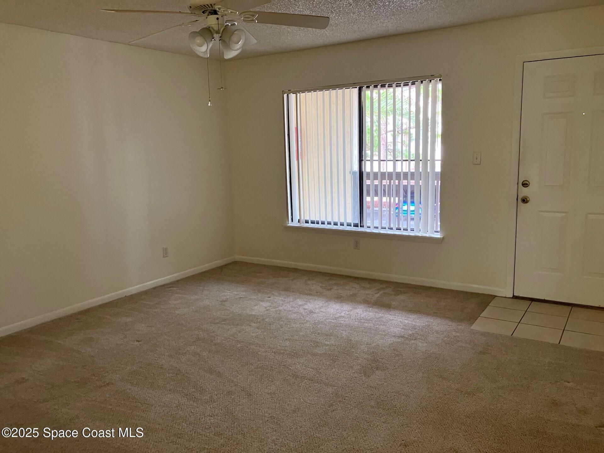 1515 Huntington Lane, Unit 223 Rockledge, FL 32955 - Photo 13 of 15 an empty room with a window