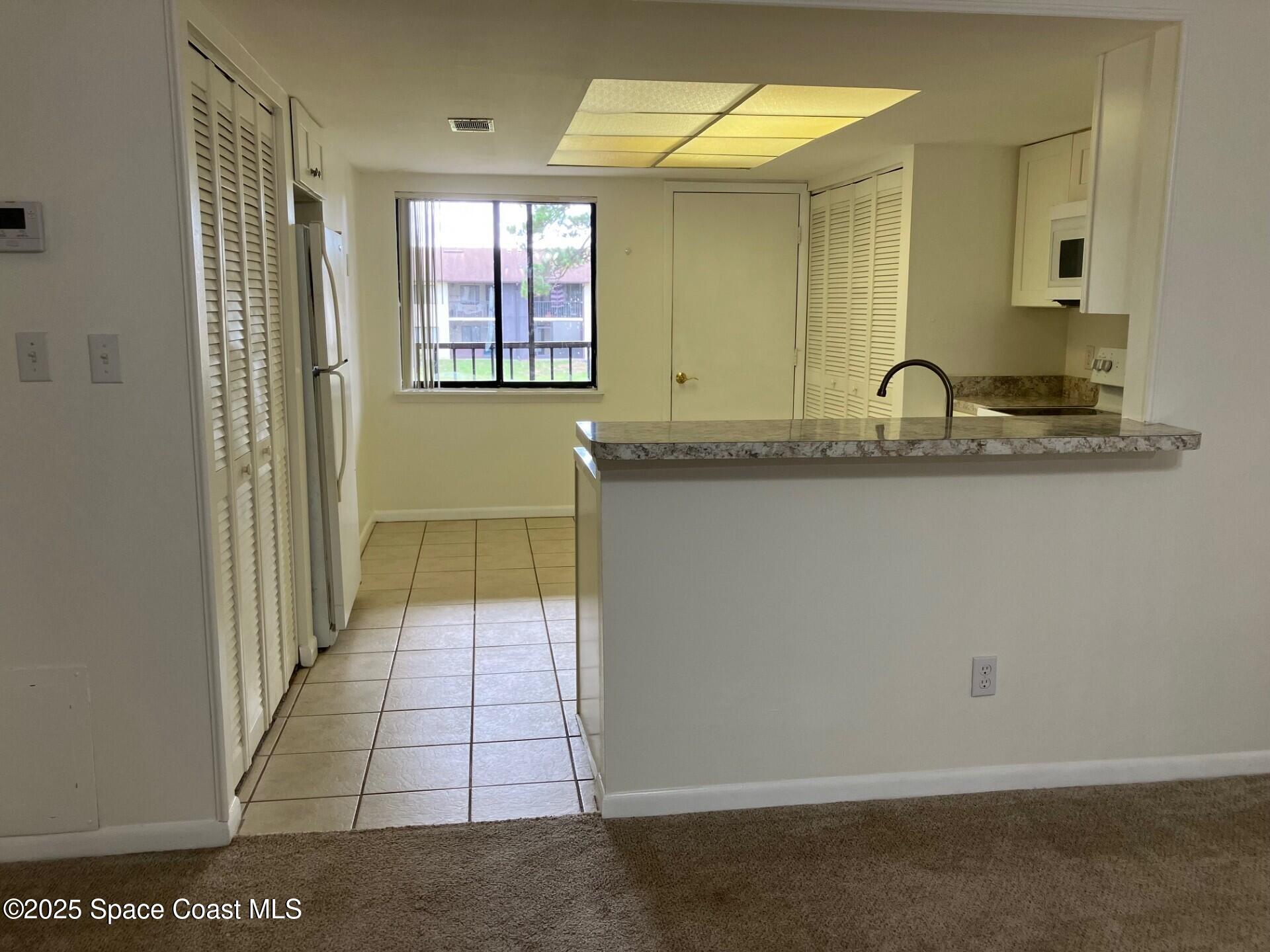 1515 Huntington Lane, Unit 223 Rockledge, FL 32955 - Photo 14 of 15 a bathroom with a sink and a mirror