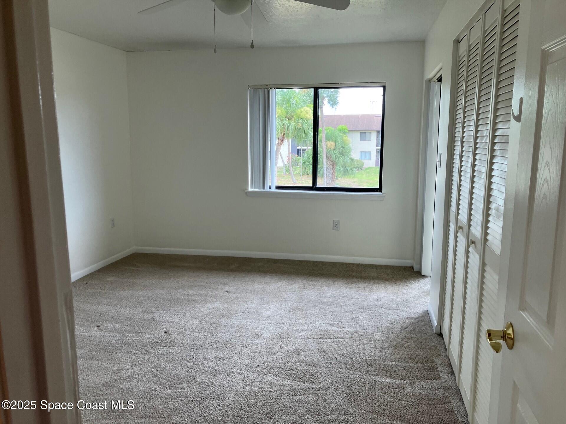 1515 Huntington Lane, Unit 223 Rockledge, FL 32955 - Photo 8 of 15 an empty room with windows