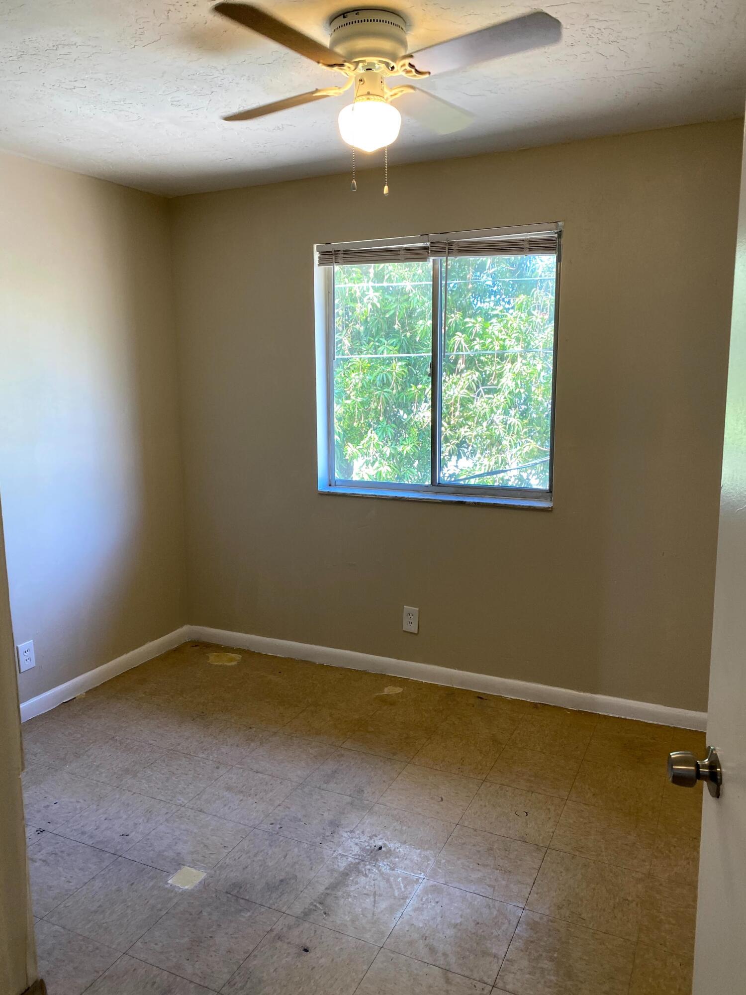 529 14th Street, Unit E West Palm Beach, FL 33401 - Photo 11 of 13 an empty room with a window