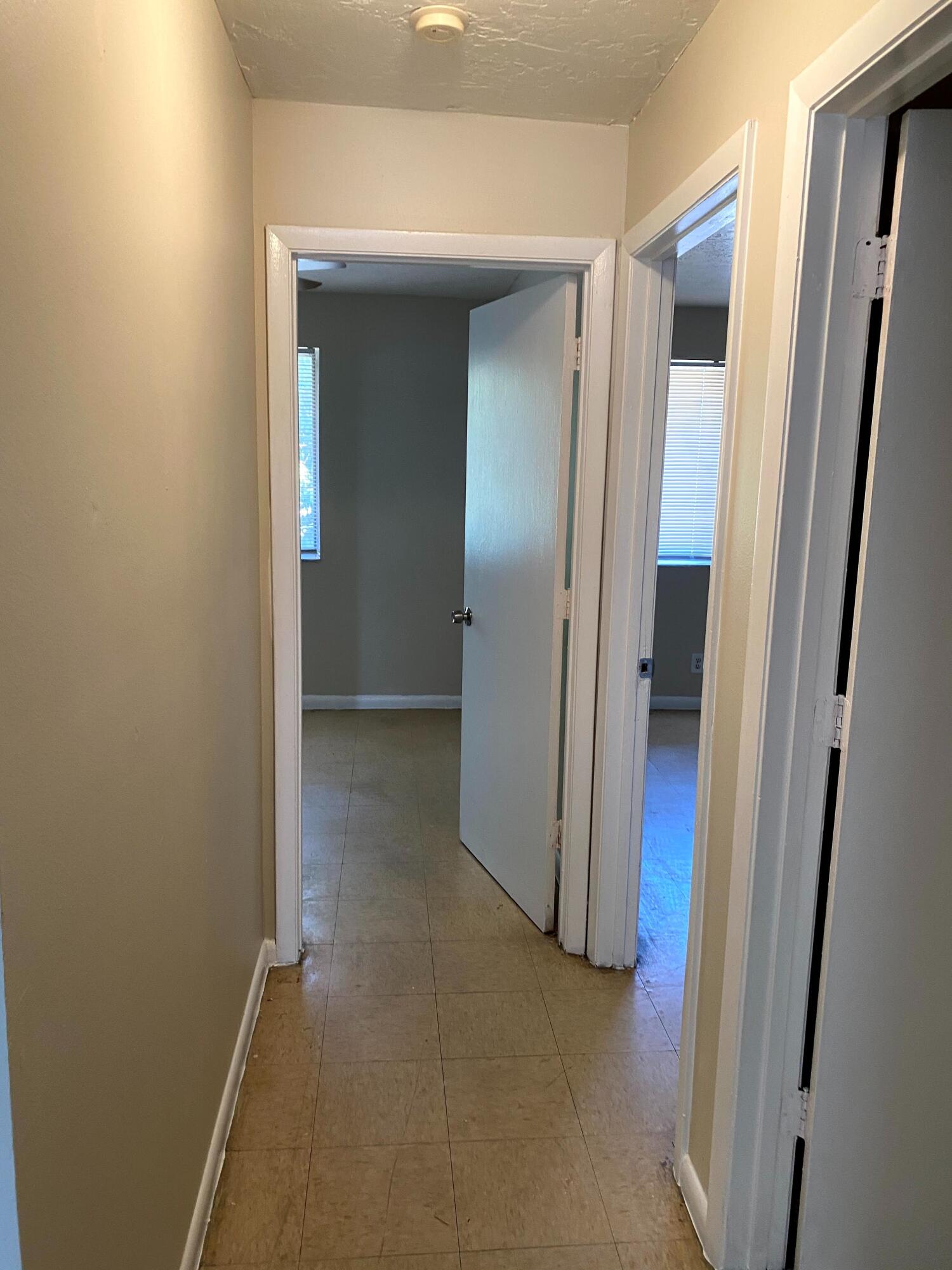 529 14th Street, Unit E West Palm Beach, FL 33401 - Photo 6 of 13 a view of a room with a hallway