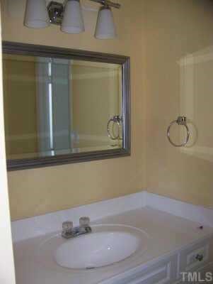 901 Plateau Lane Raleigh, NC 27615 - Photo 10 of 10 a bathroom with a sink and mirror