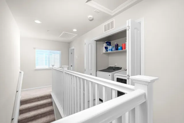 a kitchen with a refrigerator and a sink