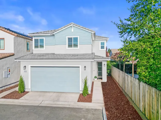 a front view of a house with garden