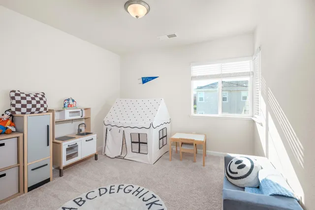 a room with furniture a washer and a window