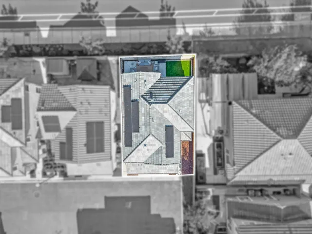 an aerial view of residential building and parking space