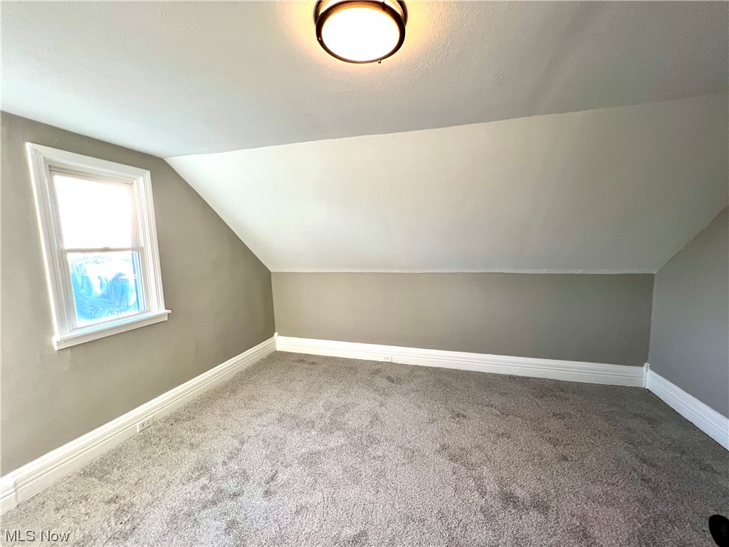 3527 Broadview Road Cleveland, OH 44109 - Photo 20 of 29 Bonus room featuring carpet floors and vaulted ceiling