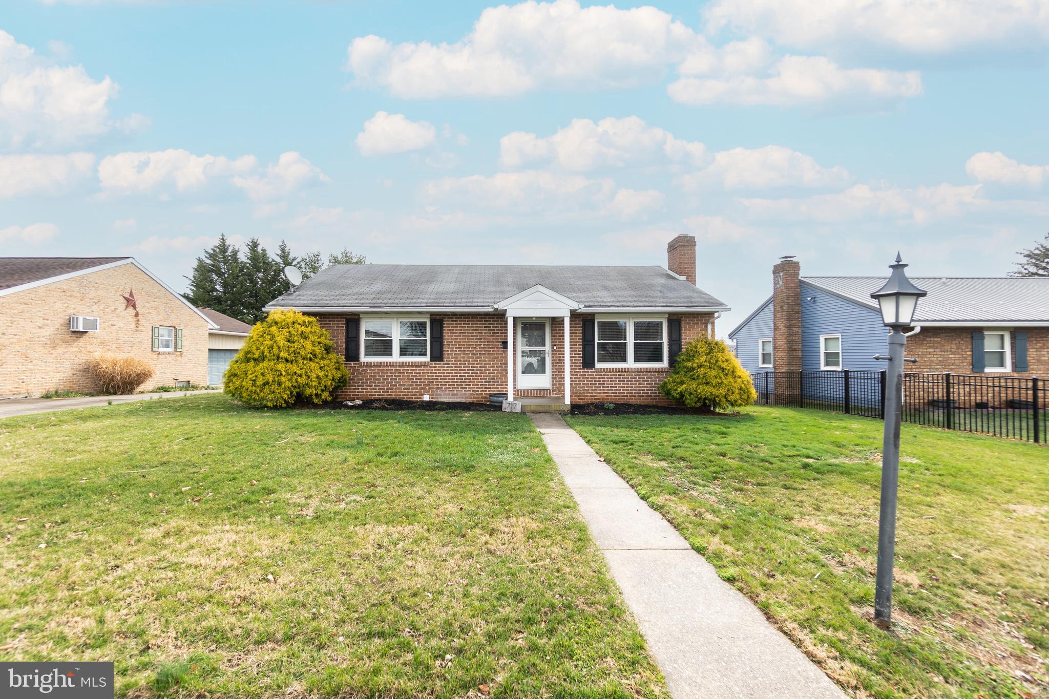 717 East Walnut Street Hanover, PA 17331 - Photo 1 of 21 a view of a big house with a big yard and potted plants