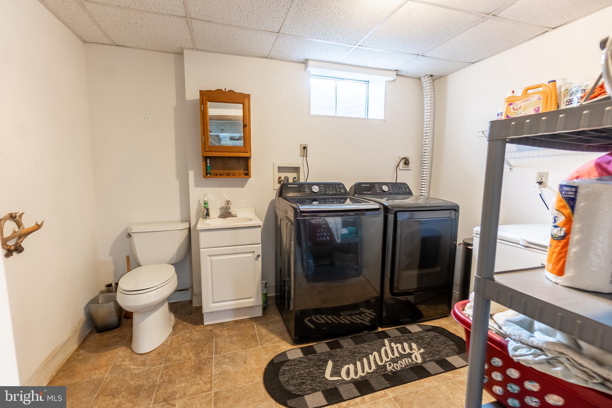 717 East Walnut Street Hanover, PA 17331 - Photo 17 of 21 a bathroom with a toilet a sink and mirror