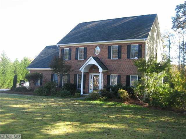 7995 Bartonshire Drive Oak Ridge, NC 27310 - Photo 1 of 16 Exterior Front.