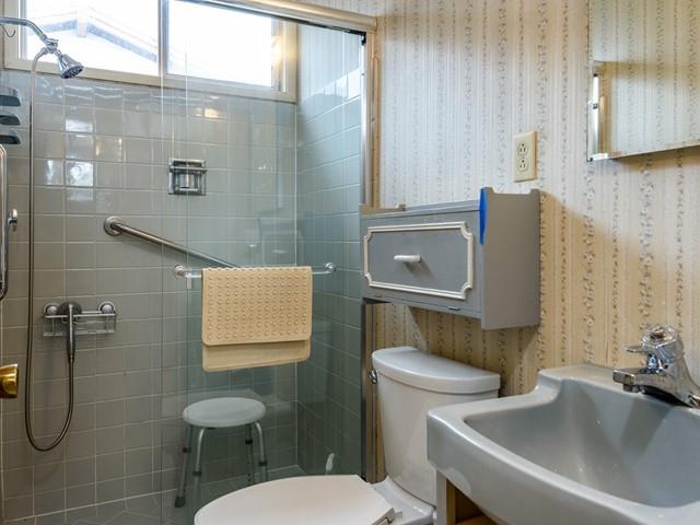 1049 Sycamore Drive Millbrae, CA 94030 - Photo 13 of 19 a bathroom with a toilet sink and shower