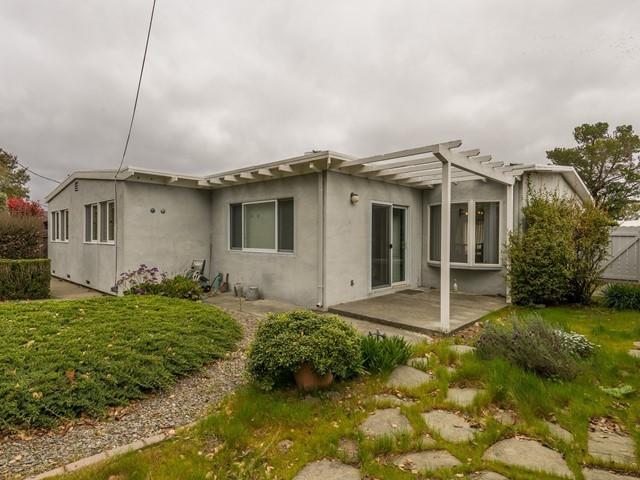 1049 Sycamore Drive Millbrae, CA 94030 - Photo 5 of 19 a front view of a house with a yard