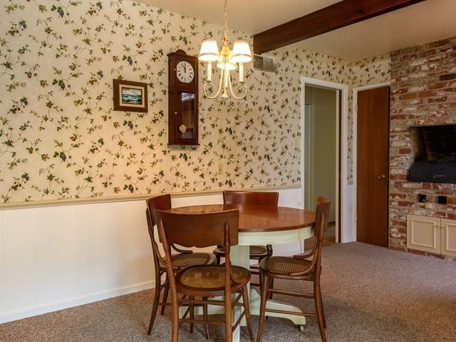 1049 Sycamore Drive Millbrae, CA 94030 - Photo 7 of 19 a view of a dining room with furniture and chandelier