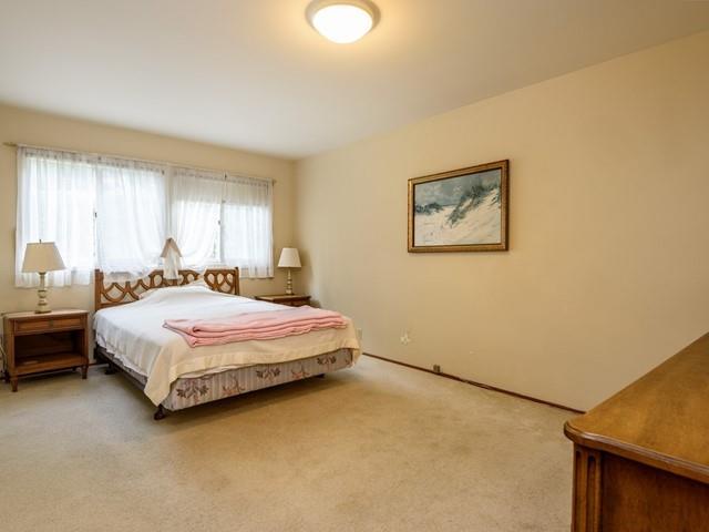 1049 Sycamore Drive Millbrae, CA 94030 - Photo 9 of 19 a bedroom with a bed and a painting on the wall