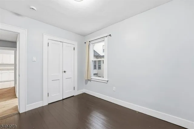 a view of a brick house with many windows