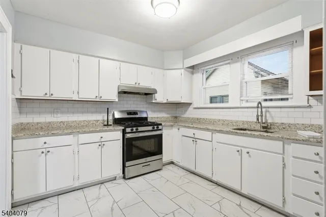 a view of a bathroom with wooden floor