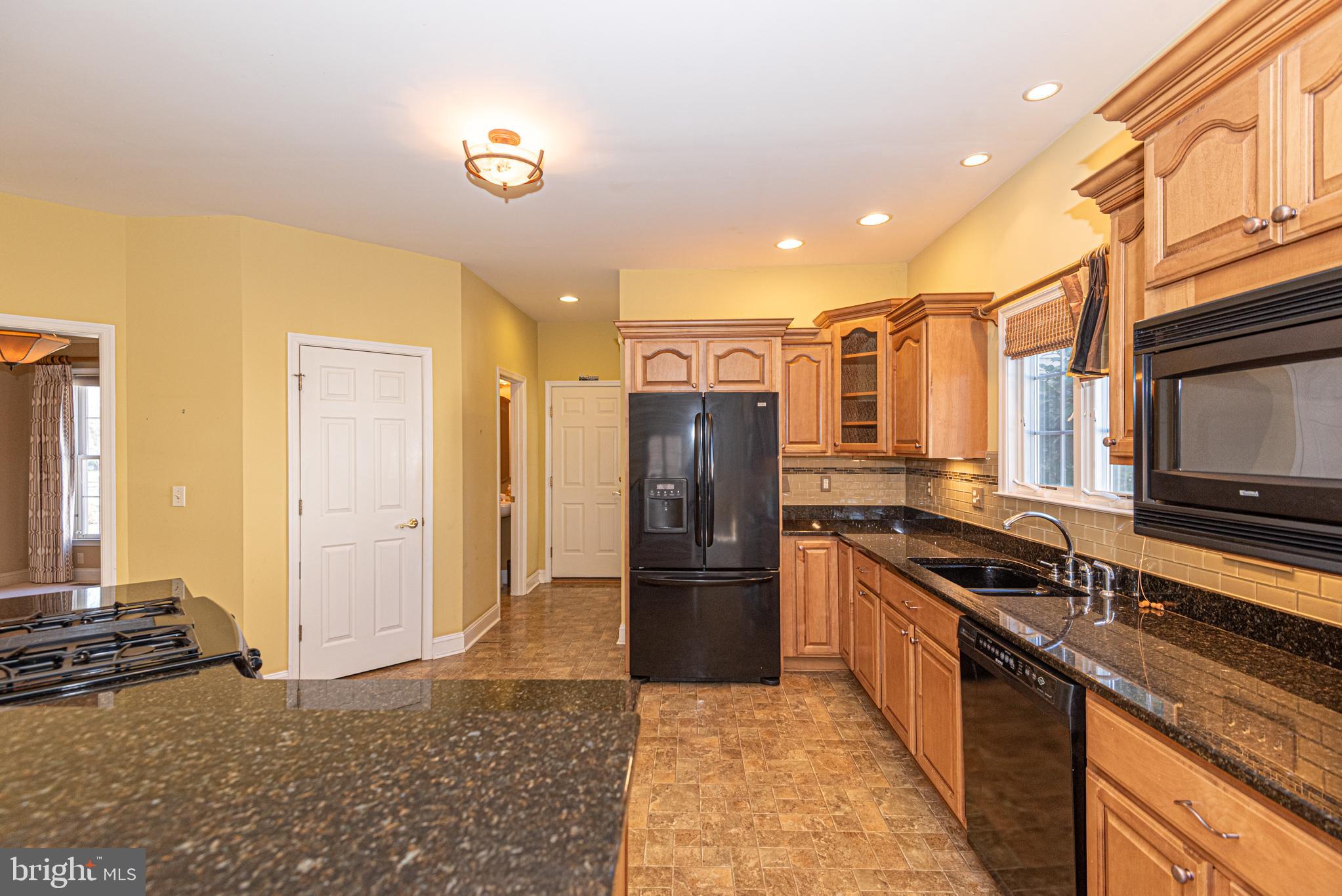 6023 Tarry Town Road Salisbury, MD 21801 - Photo 11 of 61 Warm and inviting kitchen with modern finishes.