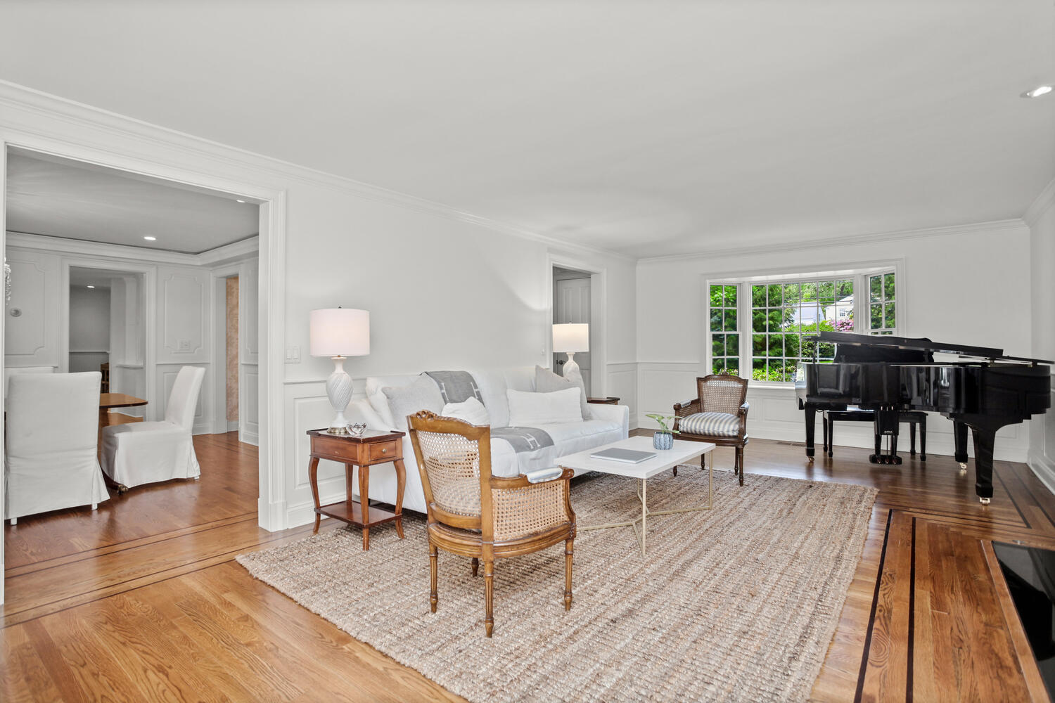 336 Hollow Tree Ridge Road Darien, CT 06820 - Photo 8 of 40 a living room with furniture a table and wooden floor
