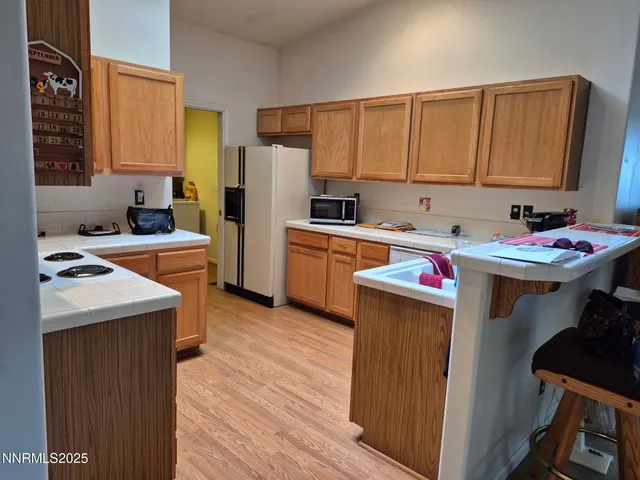 a kitchen with a sink stove and refrigerator