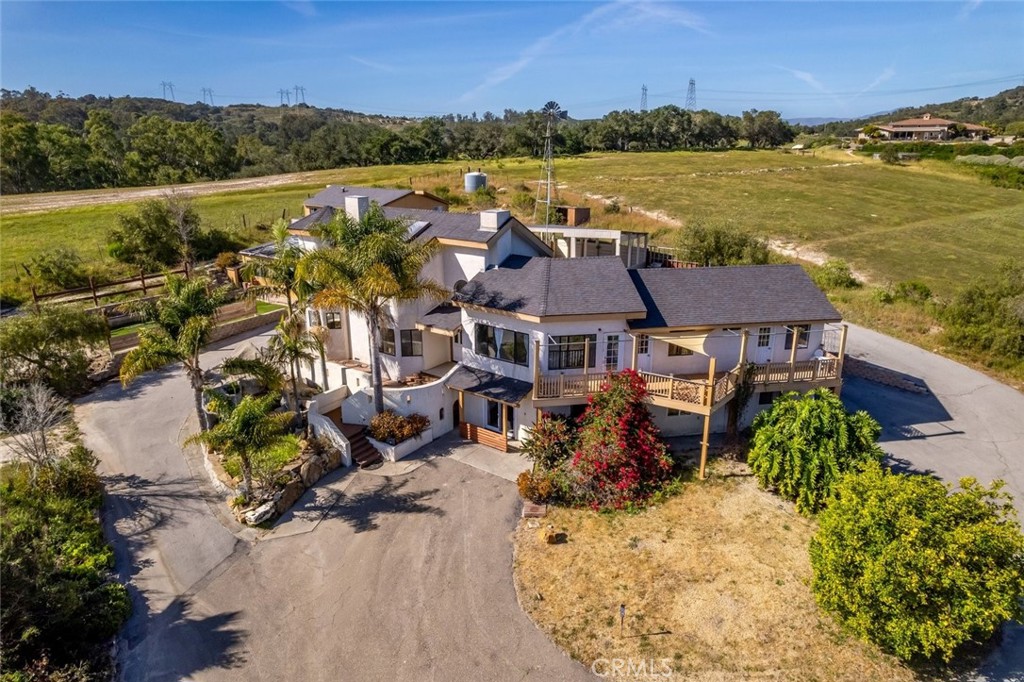 an aerial view of a house with lake view and mountain view