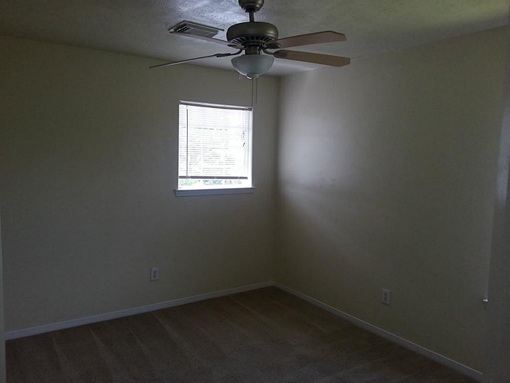 23319 Cape Cottage Court Spring, TX 77373 - Photo 23 of 23 a view of a workspace with a chandelier fan