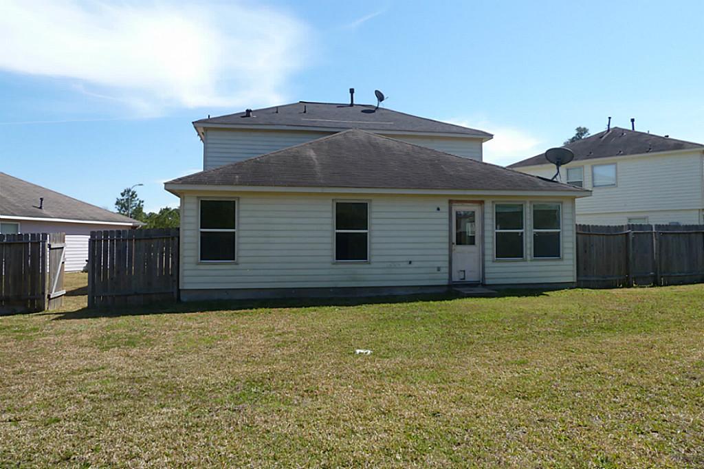 23319 Cape Cottage Court Spring, TX 77373 - Photo 3 of 23 a front view of a house with a yard