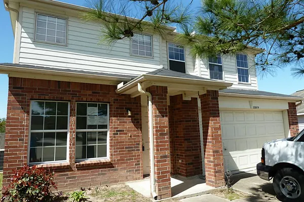 a front view of a house with a garage