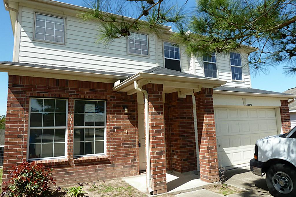 23319 Cape Cottage Court Spring, TX 77373 - Photo 4 of 23 a front view of a house with a garage