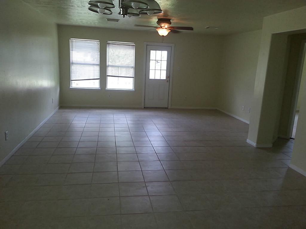 23319 Cape Cottage Court Spring, TX 77373 - Photo 7 of 23 en empty room with windows
