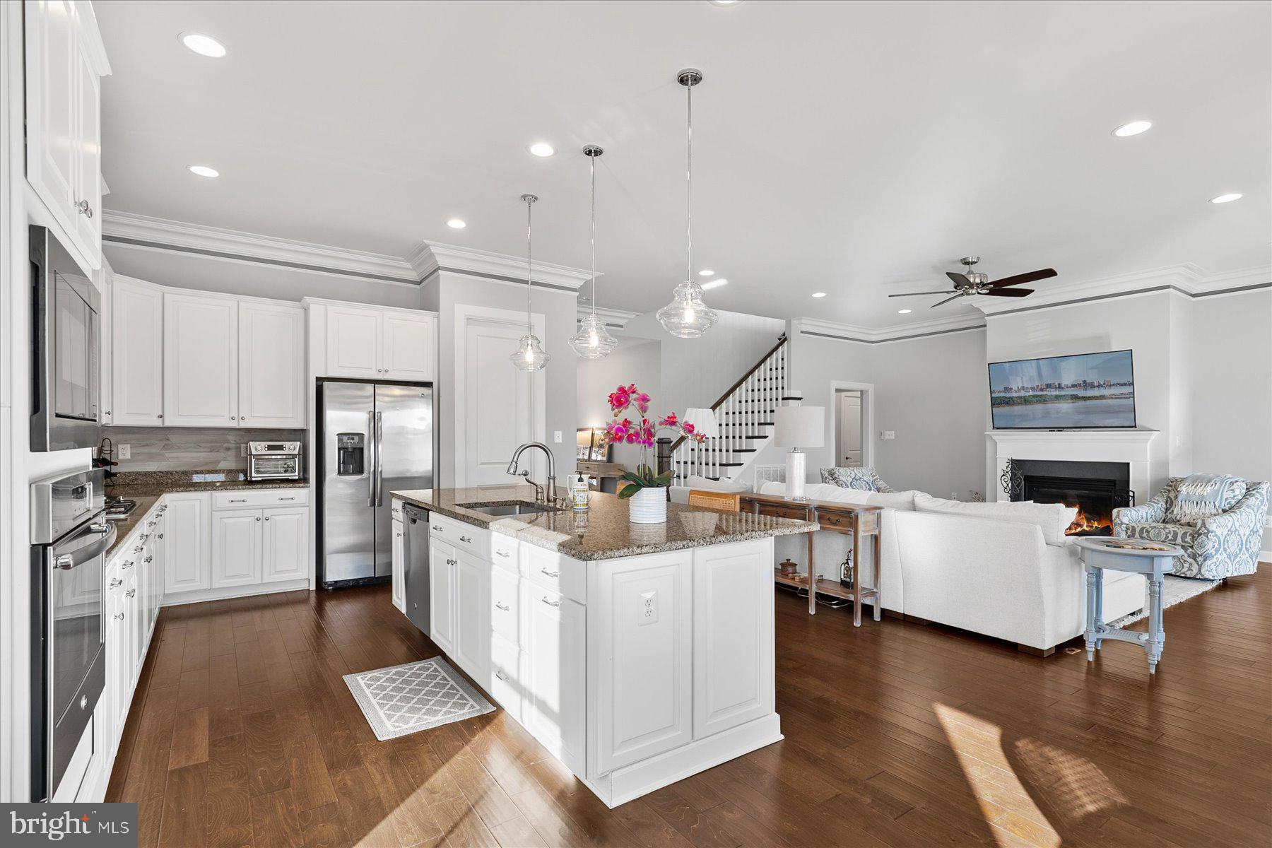 20822 Cormorant Way Ocean View, DE 19970 - Photo 16 of 91 a kitchen with white cabinets and stainless steel appliances
