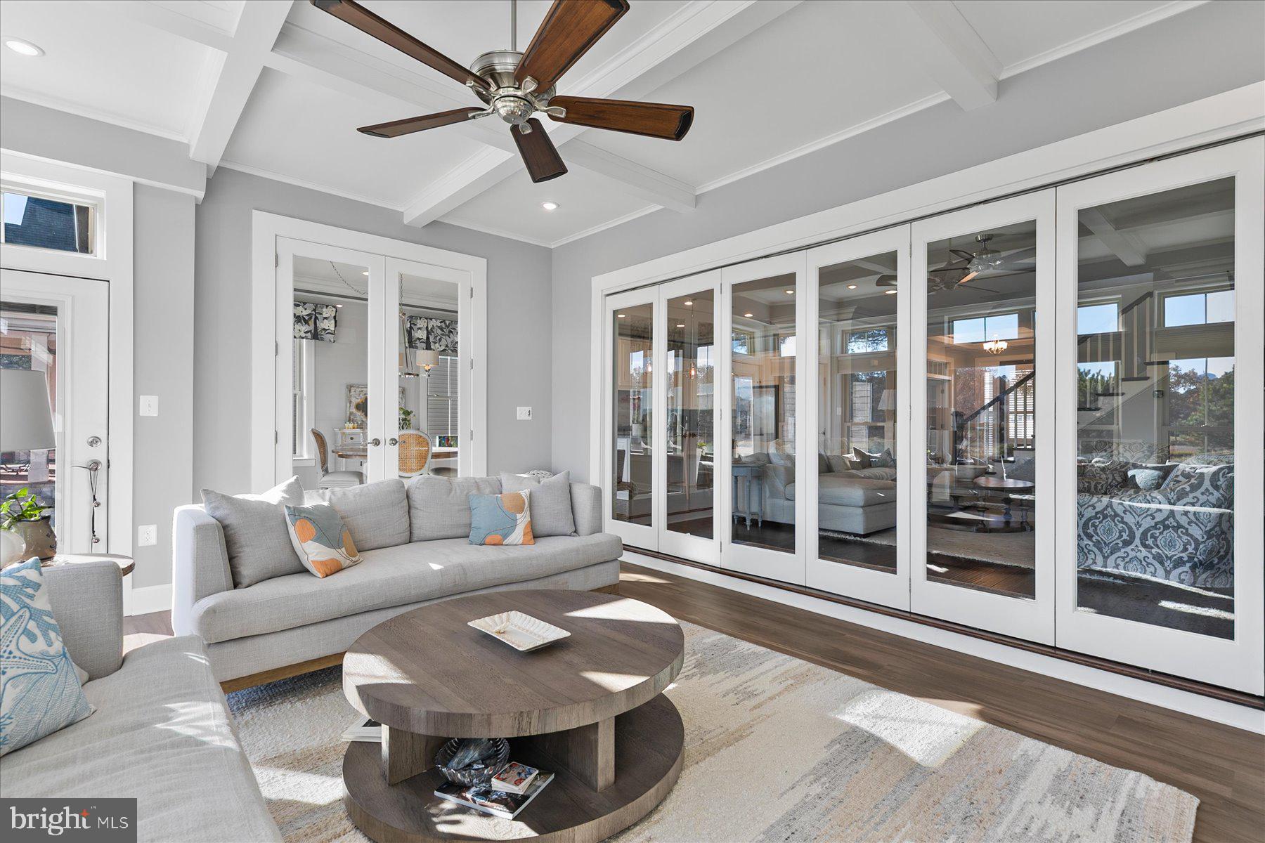 20822 Cormorant Way Ocean View, DE 19970 - Photo 24 of 91 a living room with furniture and a floor to ceiling window