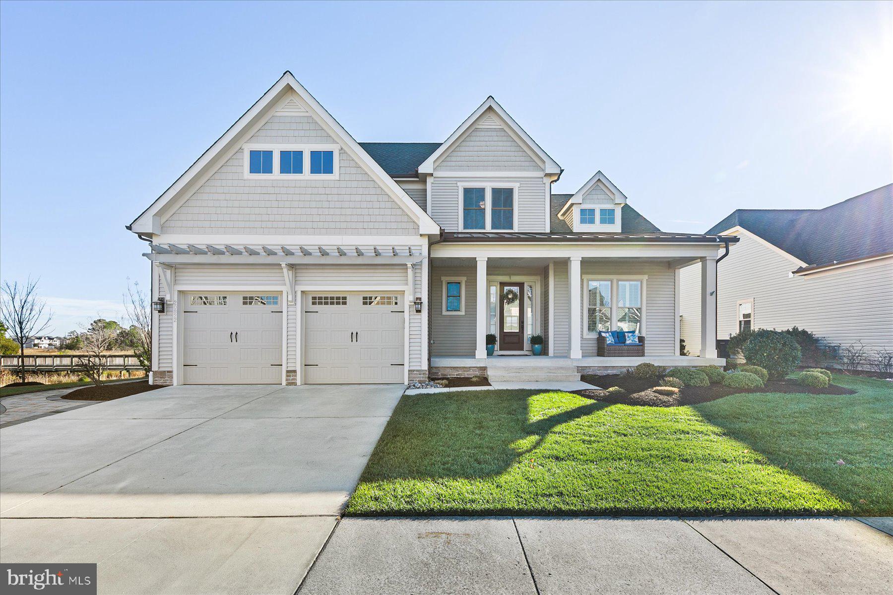 20822 Cormorant Way Ocean View, DE 19970 - Photo 3 of 91 a front view of a house with a yard and garage