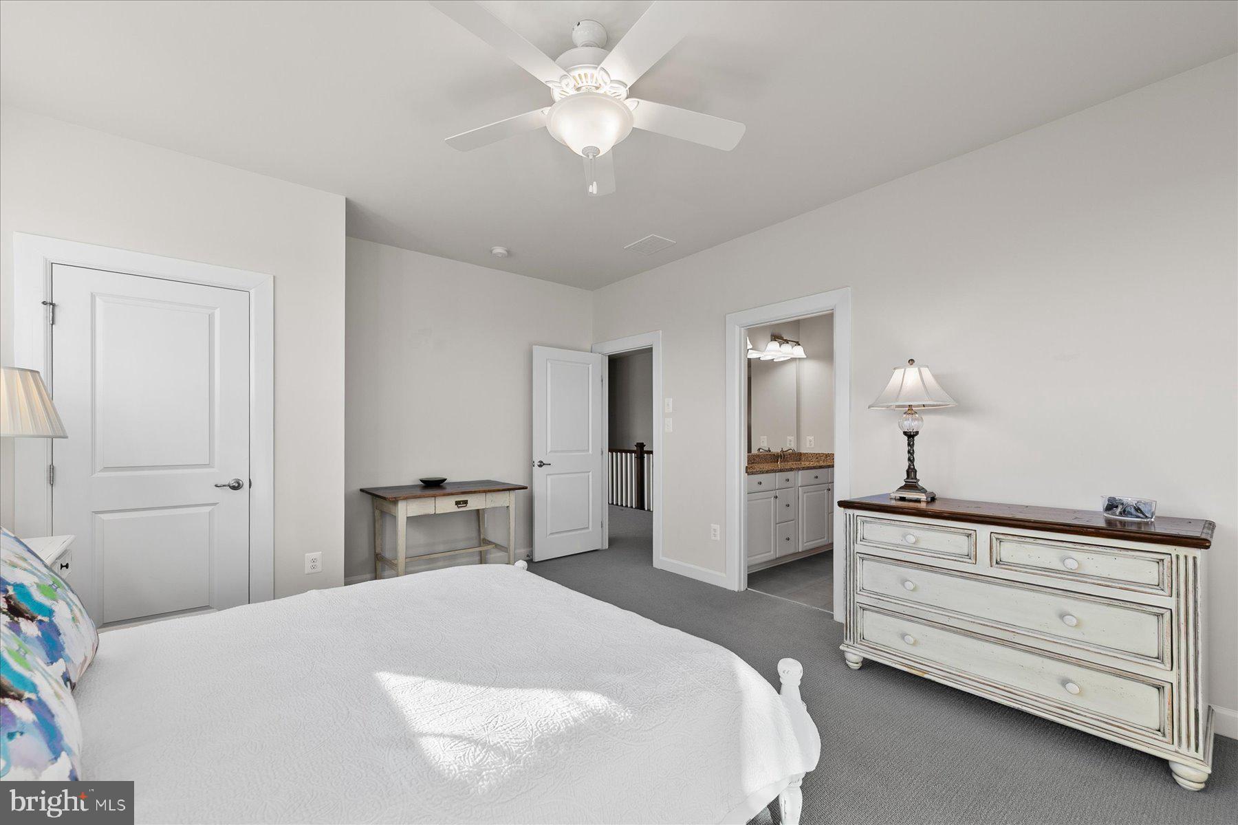 20822 Cormorant Way Ocean View, DE 19970 - Photo 33 of 91 a bedroom with a bed and a chandelier