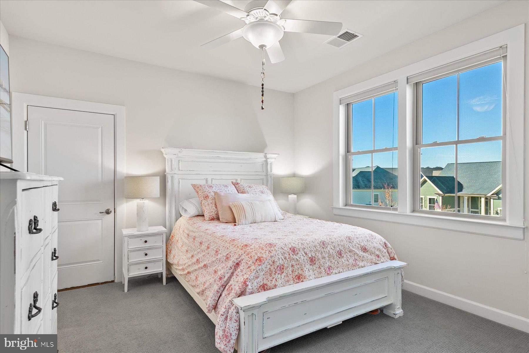 20822 Cormorant Way Ocean View, DE 19970 - Photo 39 of 91 a bedroom with a large bed and a window