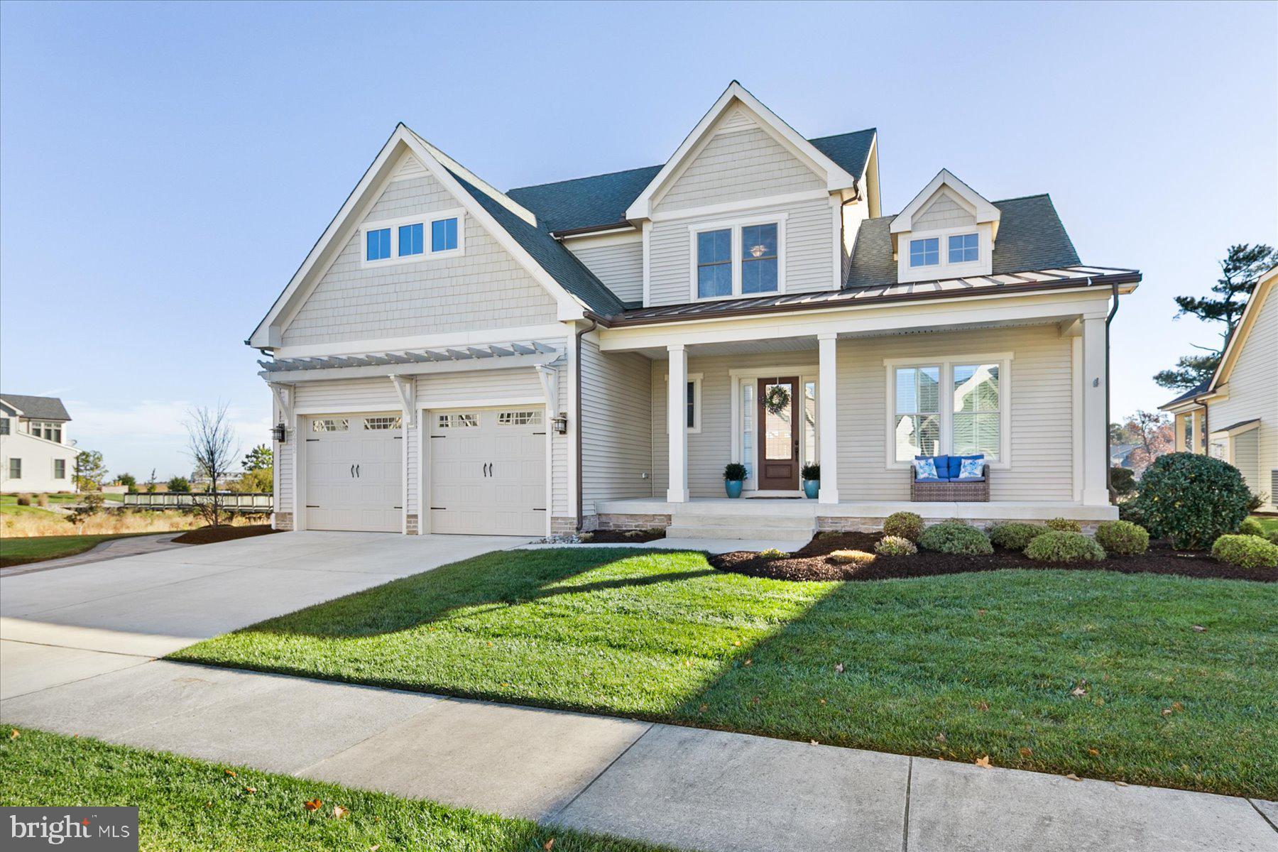 20822 Cormorant Way Ocean View, DE 19970 - Photo 4 of 91 a front view of a house with a yard and garage