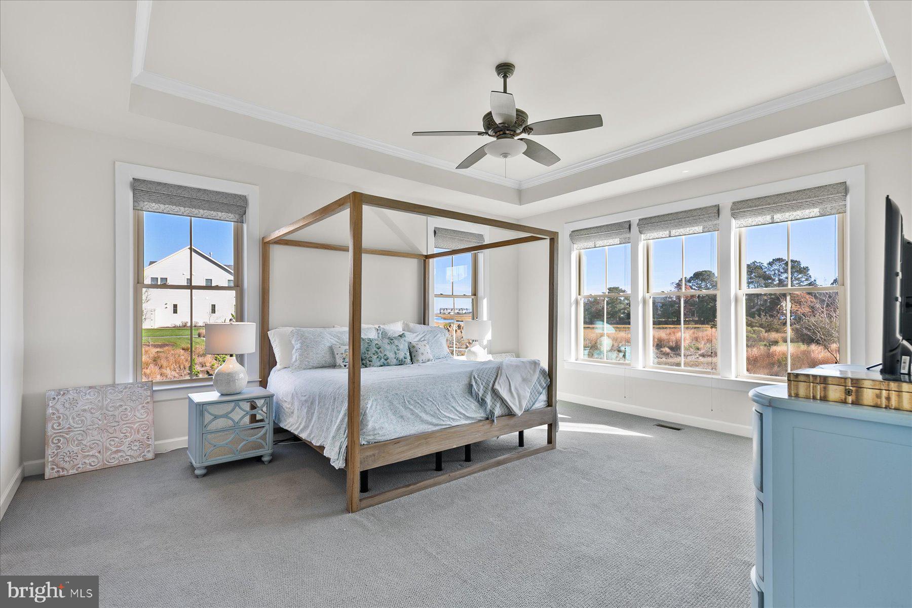 20822 Cormorant Way Ocean View, DE 19970 - Photo 42 of 91 a spacious bedroom with a bed and a large window