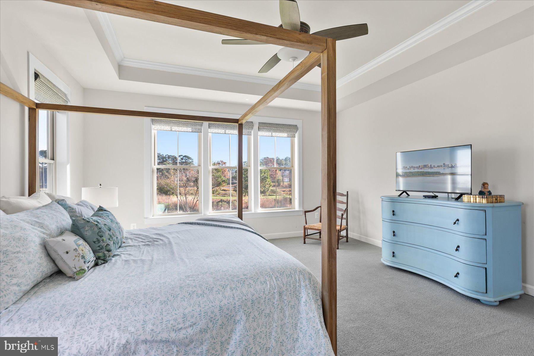 20822 Cormorant Way Ocean View, DE 19970 - Photo 43 of 91 a spacious bedroom with a large bed and a window